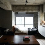 studio apartment with bed and table pictured