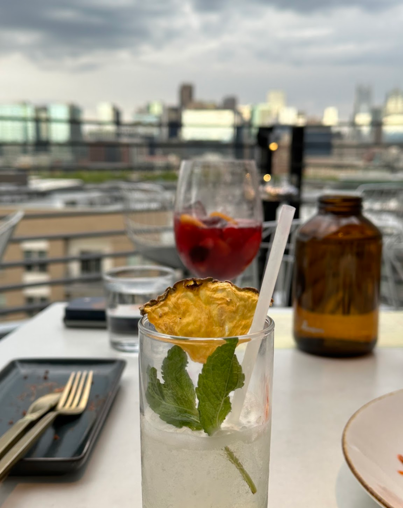 Rooftop dining with view of the city in the distance